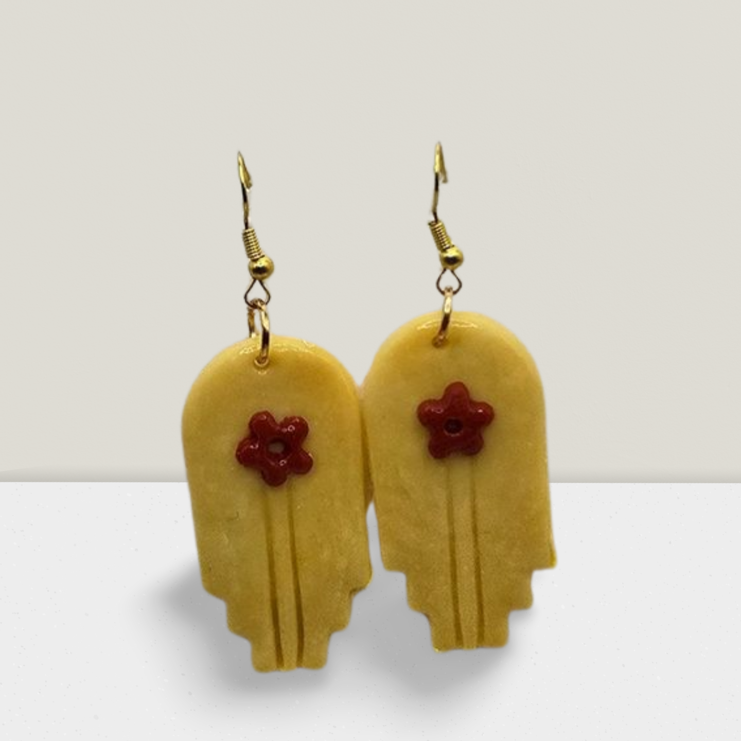 Golden Charm Earrings – Geometric Drops with Red Floral Accent