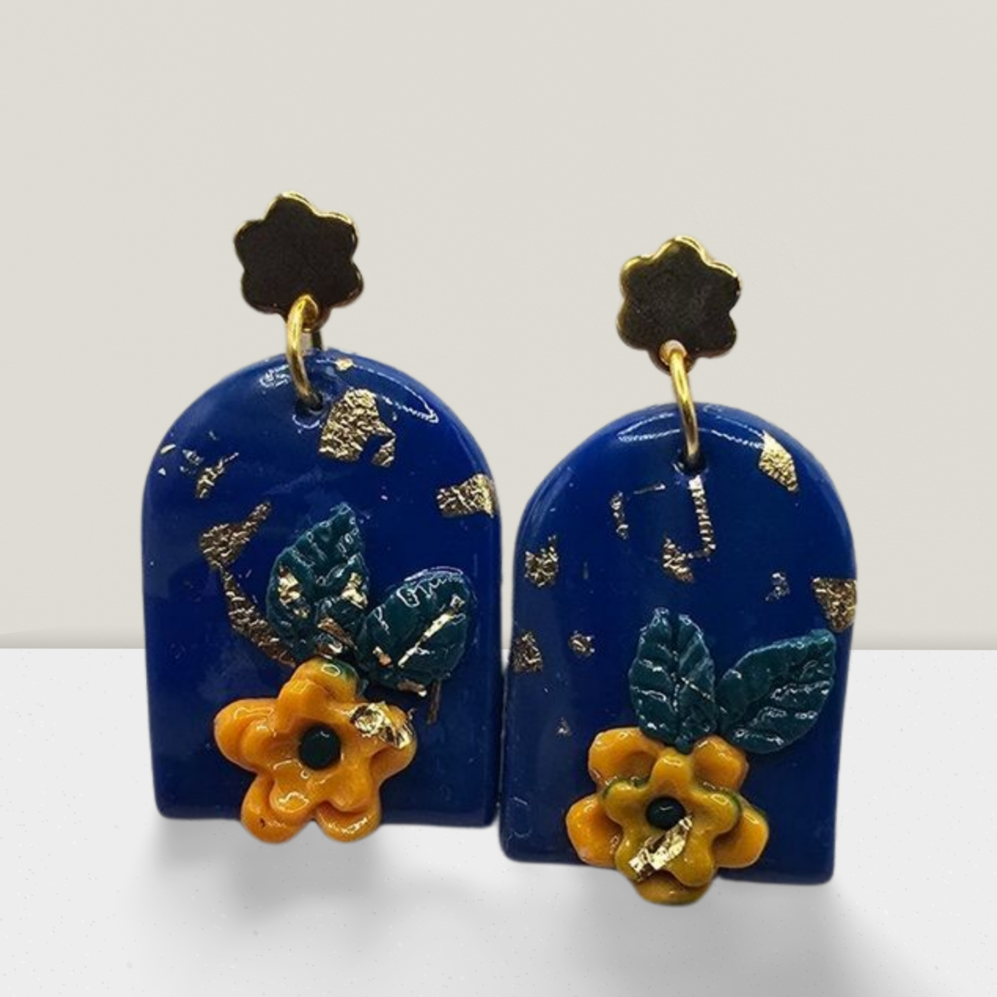 Midnight Bloom Arch Earrings – Navy Blue Resin with Yellow Floral Accents